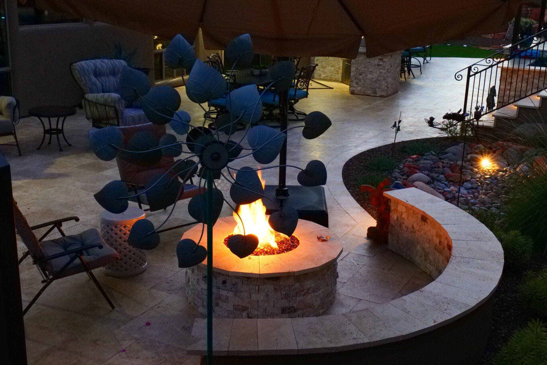Fire pit ringed by a curved seat wall