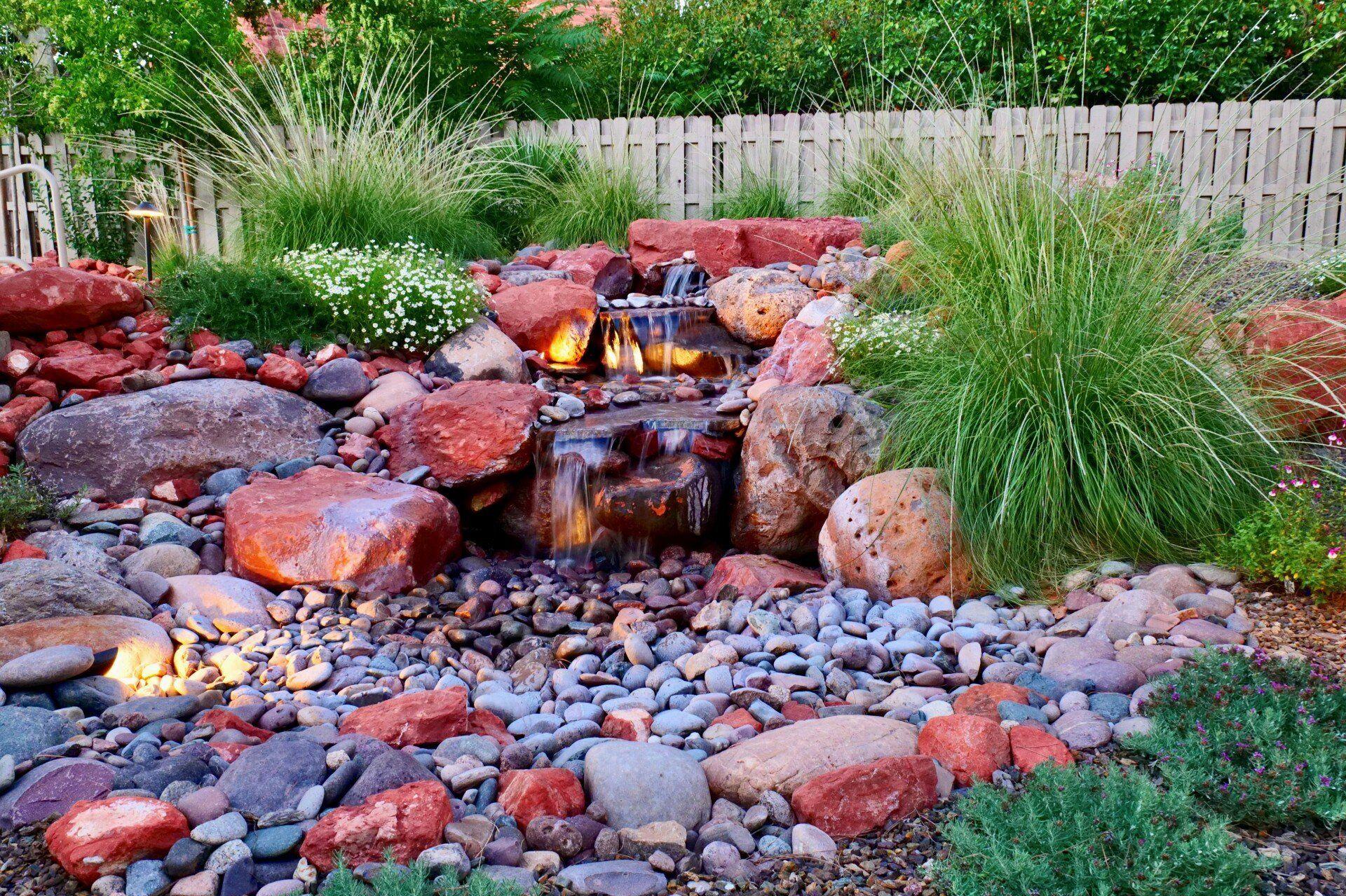 Boulder water feature and gravel stream bed