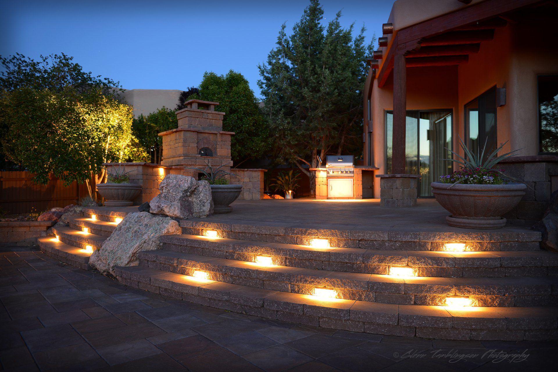 A house with stairs that are lit up at night