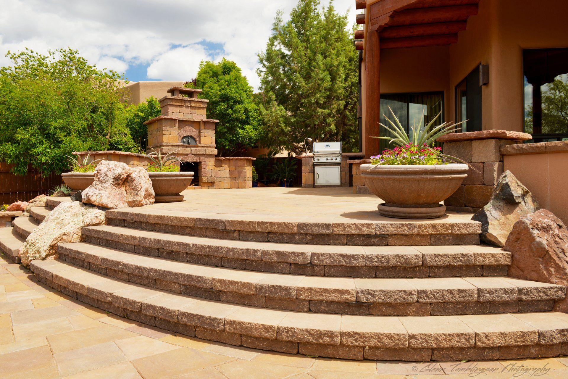 Travertine steps and outdoor fireplace on a Sedona property