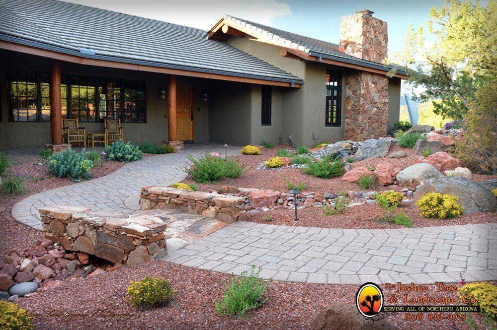 A house with a stone walkway leading to it